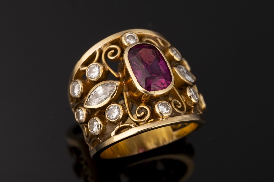 Ladies 18kt yellow gold open filigree band containing one cushion cut fine quality ruby (6.6 mm x 4.