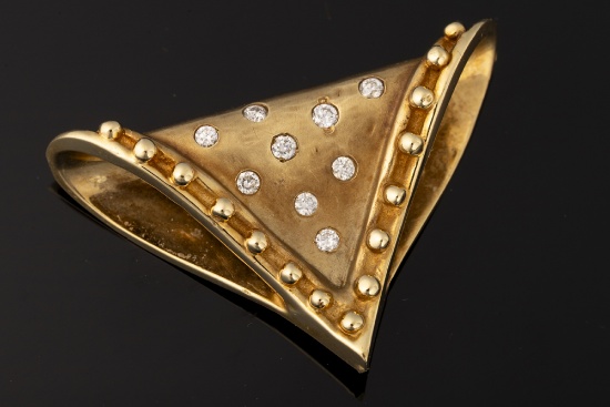 Ladies 14kt yellow gold slide pendant containing nine round brilliant cut diamonds approximately .60