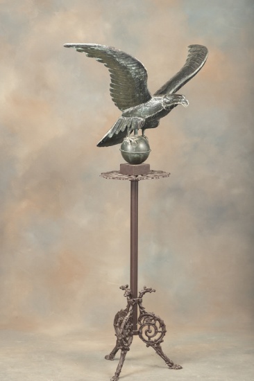 Large Eagle on metal Pedestal with footed base, 30" wing spread x 58" T. This pedestal was in Maries