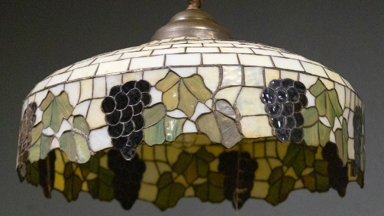 Antique leaded and stained glass hanging Dome Light Fixture, measures 24" Dia. x 12" D, in leaf and