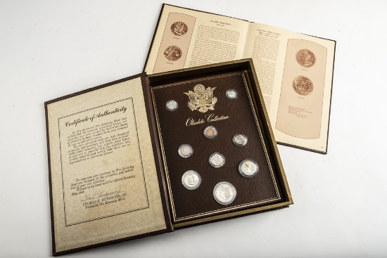 "The Kennedy Mint Portfolio of United States Coins" written by "Thomas E. Hudgeons" consisting of Fo