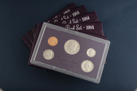 Group of five (5) uncirculated cased Proof Sets, dated 1984, totaling 25 Coins. Each case contains,