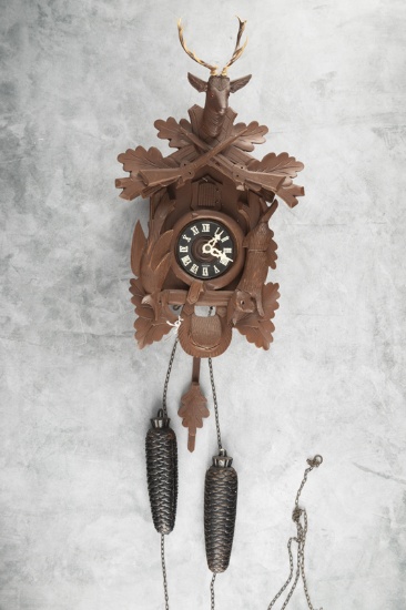 German two-weight Cuckoo Clock with stag head crest. Clock measures 16" T with removable crest. Comp