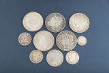 A collection of ten (10) vintage American Silver Coins to include: One O Mint Silver Dollar, dated 1