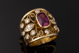 Ladies 18kt yellow gold open filigree band containing one cushion cut fine quality ruby (6.6 mm x 4.