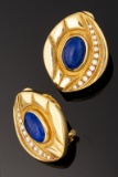 Ladies 18kt yellow gold omega clip earrings containing 7.60ctw lapis and .45ctw round brilliant cut