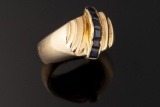 Ladies 14kt yellow gold dome ring containing six 3x3 mm princess cut sapphires. Ring weighs 12.7 gra