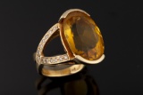 Ladies custom 14kt yellow gold ring containing on 20x15 mm oval citrine and 26 round brilliant cut d