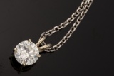 One Ladies 14kt W/G four prong pendant containing a 1.12ct round brilliant cut diamond possessing I