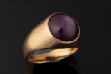 Ladies 14kt yellow gold ring weighing 10.5 grams. Ring contains one 11.88 mm Cabochon star ruby (fin