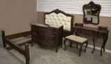 Antique four(4) piece carved Mahogany Bedroom Suit. Including a full size Bed with button tufted hea
