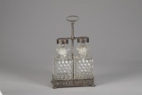 A vintage, fine quality silver and glass Tantalus (portable Bar) marked on base 