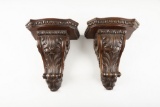 Matched pair of carved Corbels (Shelves), very good condition with heavy brass hanging brackets. WIL
