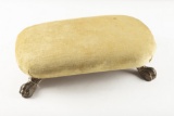 Antique Footstool with iron claw feet, measures 18 1/2