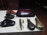 3 holsters, pistol cleaning set, 2 powder flasks cleaning rods & brushes
