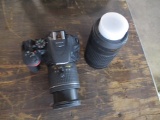 Nikon D5600 18-55 mm lens, 70-300 mm lens, 2 batteries, charger & bag.
