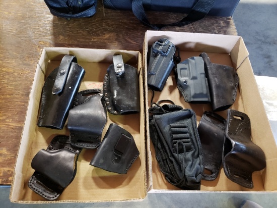 2 boxes of holsters