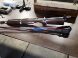 Rifle stock, assorted gun cleaning rod, gun rack