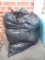 Trash bag filled with 12 ga. wads