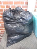 Trash bag filled with 12 ga. wads