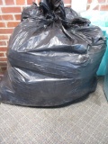 Trash bag filled with 12 ga. wads