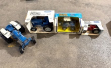 3 ERTL FORD TRACTORS IN BOX & 1 UNKNOWN