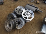 BUNCH OF RIMS AND TRUCK FENDER