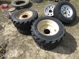 (4) 10X16.5 SKIDSTEER TIRES ON RIMS