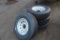 (4) NEW ST 235/80R16 14 PLY TIRES ON 8 HOLE RIMS