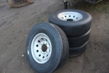 (4) NEW ST 235/80R16 14 PLY TIRES ON 8 HOLE RIMS