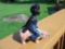 Black Boy Riding Pig Coin Bank Cast Iron
