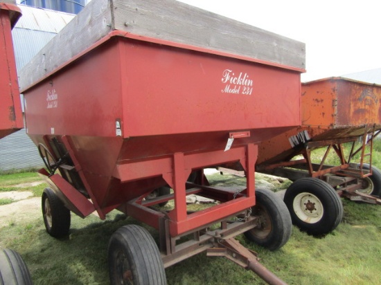721.  Ficklin Model 231 Gravity Box with Wood Extensions on Early Harms Four Wheel Wagon