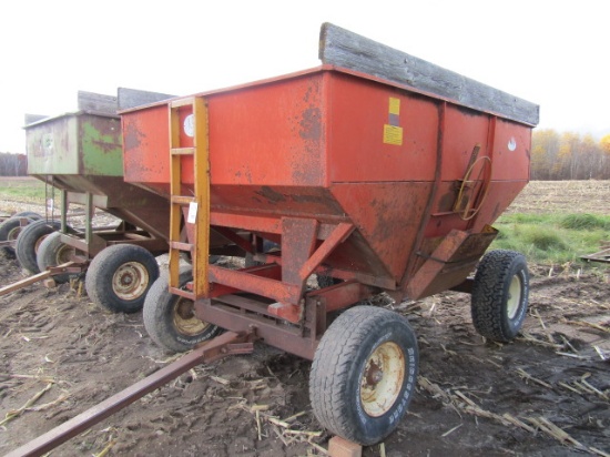 823. J&M 200 Bushel +/- Gravity Bon on Harms Four Wheel Wagon