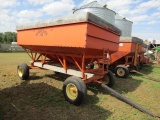 1650. MN 250 Gravity Box with Wood Extensions on MN 7 Ton Four Wheel Wagon,