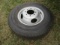 925-A. ST 235/80R/16 Tire on 8 Hole HD Rim, Fits Felling Flat Bed Trailer