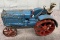 Arcade McCormick-Deering tractor with man, Approx. 7”