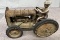 W & K Cast Iron Fordson tractor with man, tires are weathered, Approx. 5 ½”