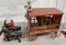 Circus trailer with man and 2 Cast Iron horses, one with rider, cast iron lion, Approx. 14”