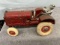 Arcade McCormick-Deering tractor with man, tires weather checked, Approx. 7 ½”