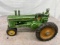 Arcade John Deere tractor with man, Approx. 7”