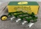 John Deere 4 bottom plow, new in box, one flap is tore