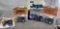 (4) 1/64 Ford tractors, TW-20, TW-25, TW-35, and TW-35 with loader, new in bubbles, $x4