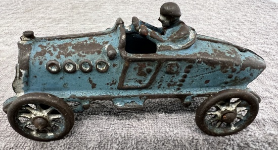 Cast Iron race car with man, has had some repair, approx. 5 ¼”