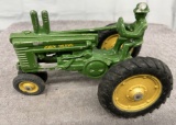 Arcade John Deere 2 Cylinder tractor with man, paint chips, Approx. 7”