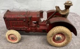 Arcade McCormick-Deering tractor with man, Approx. 7”