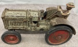 Cast Iron McCormick-Deering tractor with man, Approx. 7”