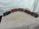 Cast Iron locomotive with coal car and 4 passenger cars, one money