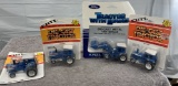 (4) 1/64 Ford tractors, TW-20, TW-25, TW-35, and TW-35 with loader, new in bubbles, $x4