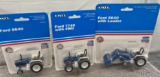 (3) 1/64 Ford tractors, 6640, 7740, and 5640 with loader, new in bubbles, $x3