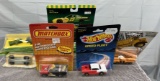 Boxed lot (3) cars, (2) Mini Macks, 1996 John Deere racecar, new in bubbles, one money